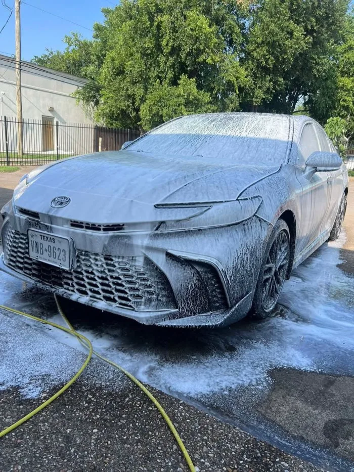 Camry covered in foam before detailing